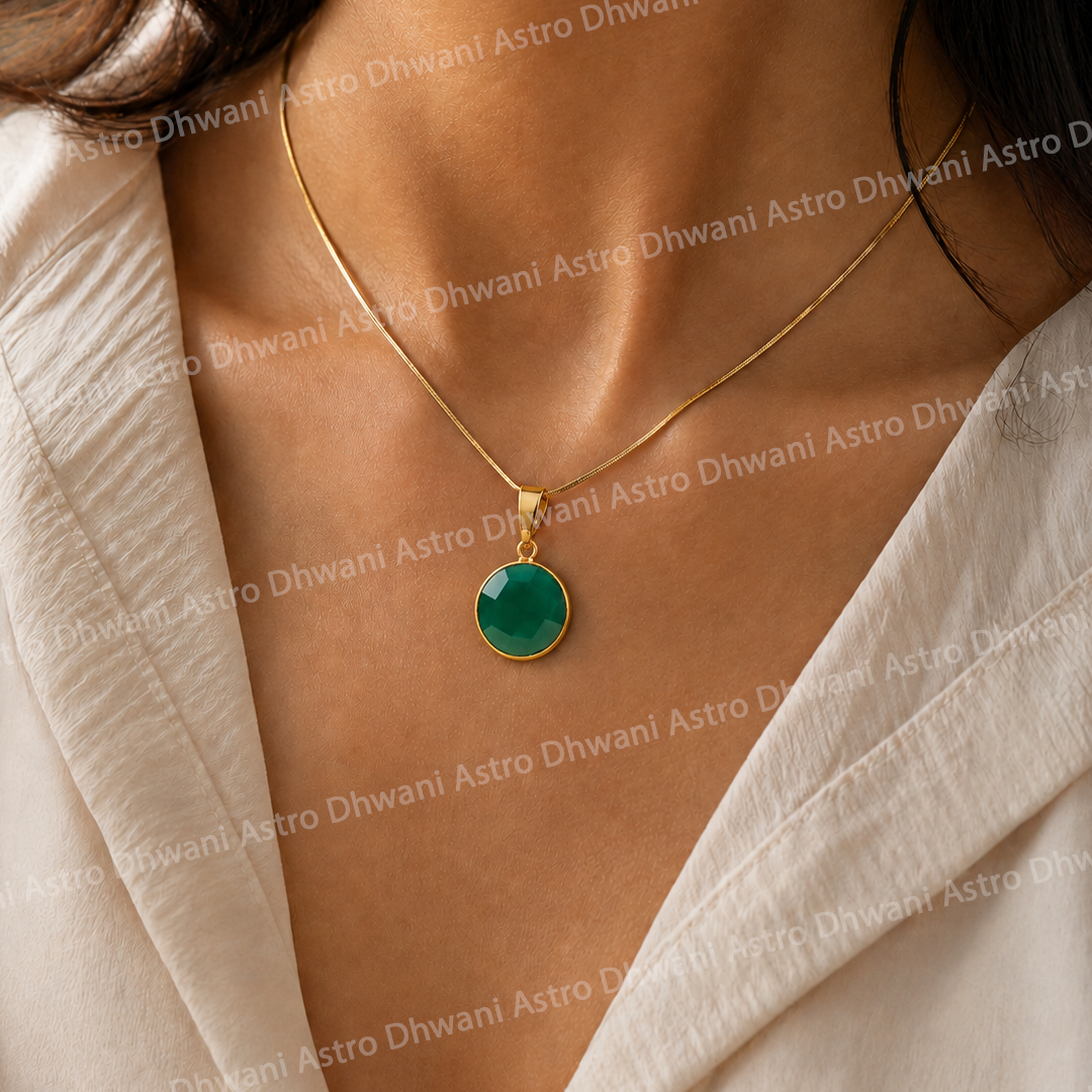 Gold necklace with a green pendant on a person wearing a beige top.Round Green Onyx Aura Pendant in Real 24KT Gold Electroformed
