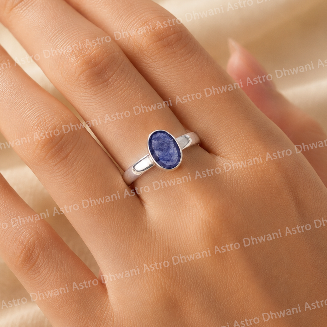 Silver ring with a blue gemstone on a handBlue Sapphire Ring for Wisdom, Confidence & Positive Energy