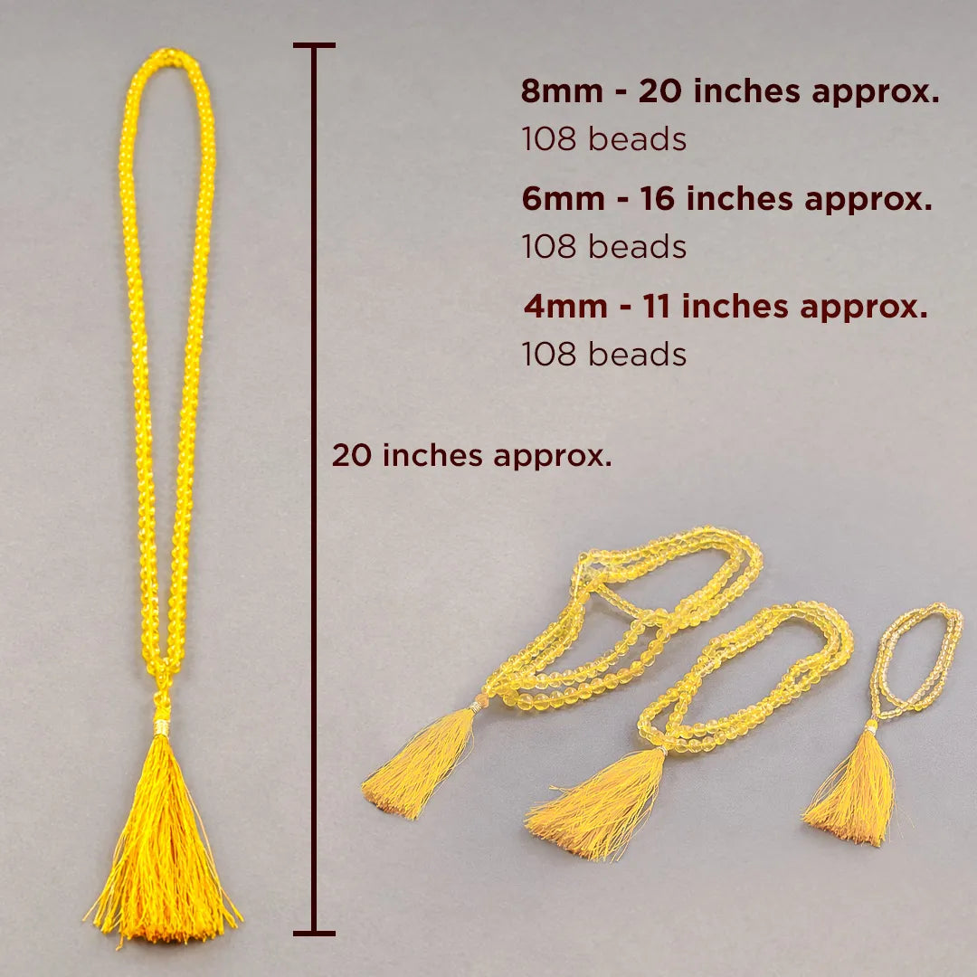 Yellow beaded necklace with measurements on a gray background