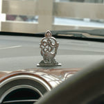 Decorative car emblem on a car hood with a blurred background