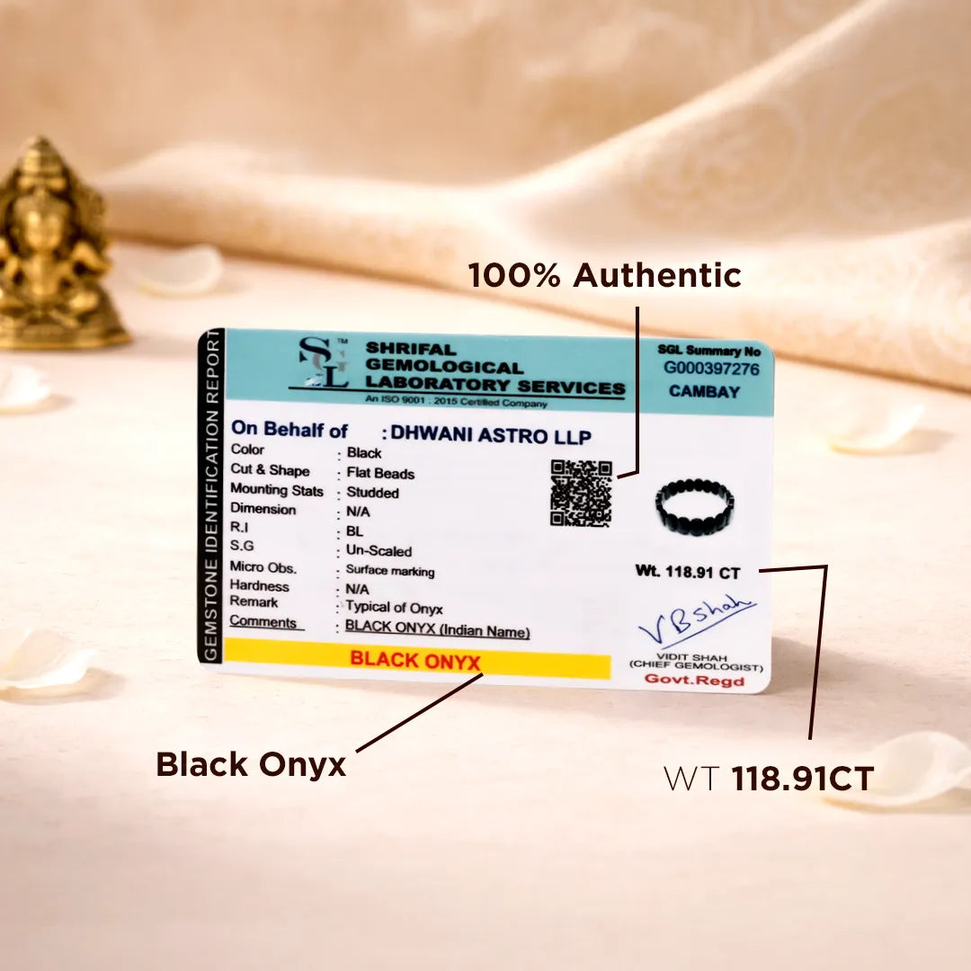 Certification label for black onyx stone with Shriram Geno lab details on a soft fabric background.
