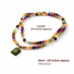 Colorful beaded necklace with a green pendant on a white background