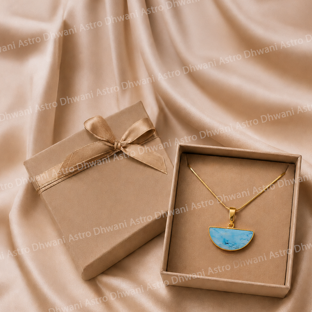 Gold necklace with a blue pendant in an open box on a beige fabric backgroundHalf Moon Turquoise Aura Pendant in Real 24KT Gold Electroformed
