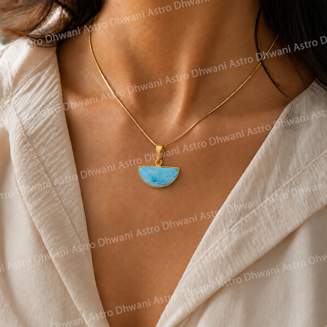 Necklace with a blue pendant worn by a person in a light-colored outfit.Half Moon Turquoise Aura Pendant in Real 24KT Gold Electroformed