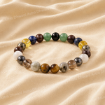 Multicolored beaded bracelet on a beige fabric background