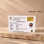 Precise Gemological Laboratory identification report card on a wooden surface