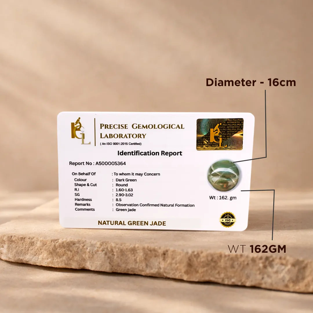 Precise Gemological Laboratory identification report card for a natural green jade stone on a wooden surface.