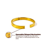 Gold bracelet with openable/hinged mechanism on a white background