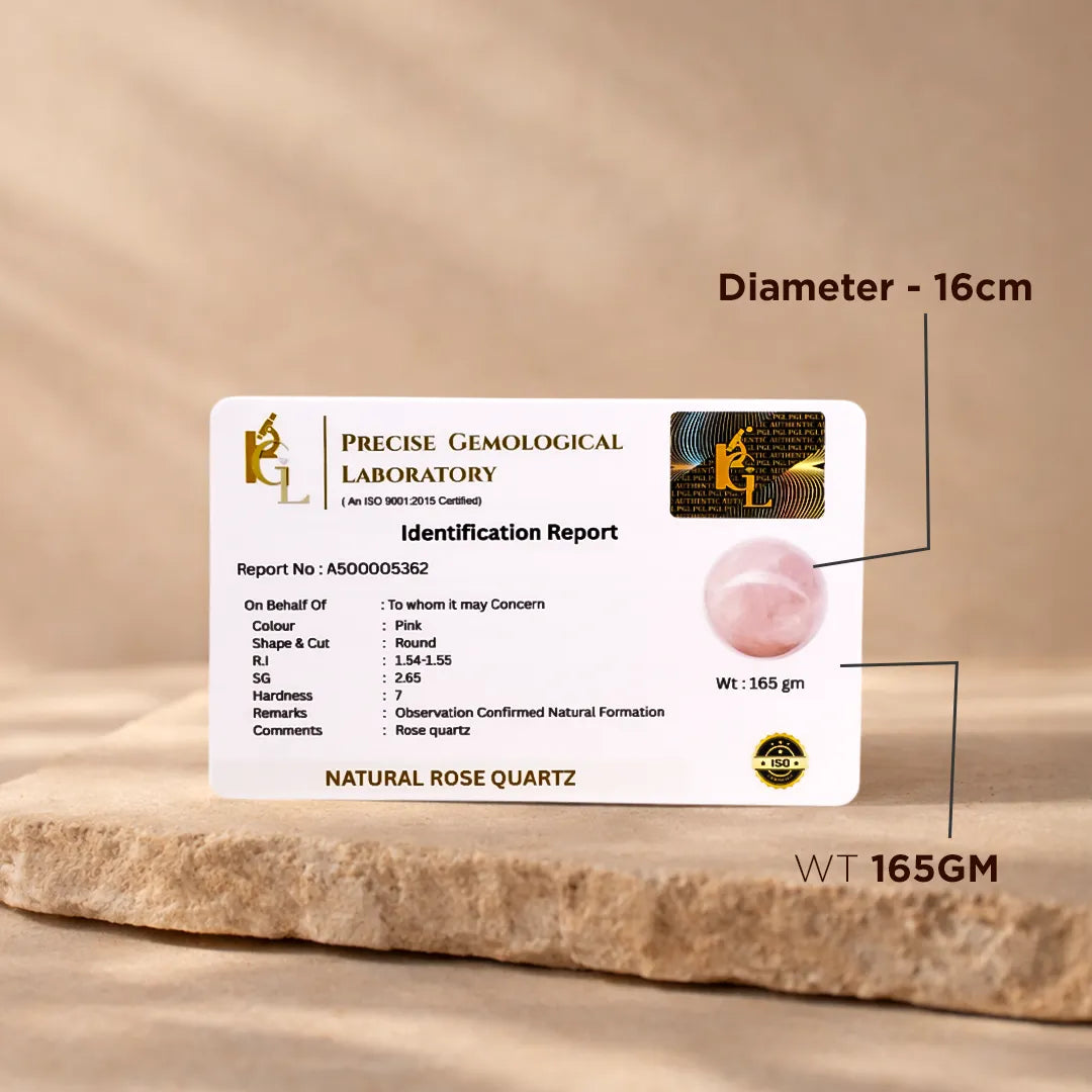 Identification report card for natural rose quartz with gemstone on a wooden surfaceNatural Rose Quartz Crystal Ball – Abhimantrit & Certified