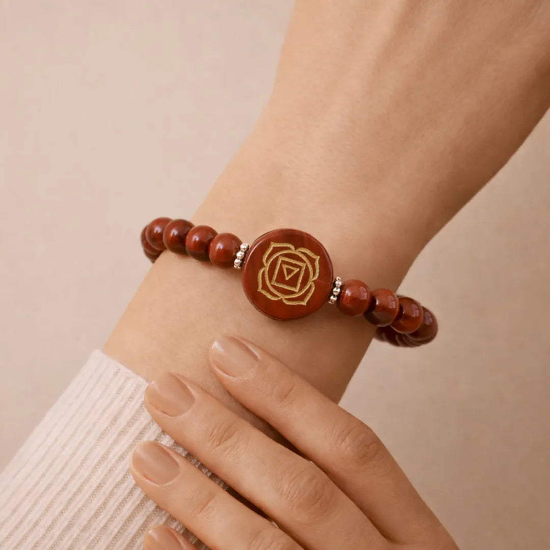 Bracelet with brown beads and a central rose design on a wrist against a beige background