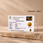 Identification report card from Precise Gemological Laboratory on a wooden surface