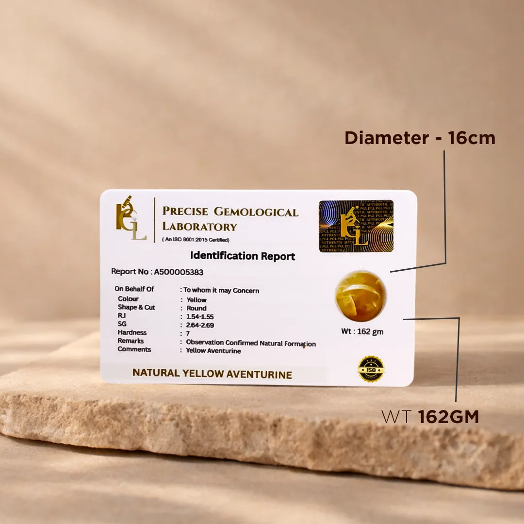 Identification report card from Precise Gemological Laboratory on a wooden surfaceNatural Yellow Aventurine Crystal Ball – Abhimantrit & Certified