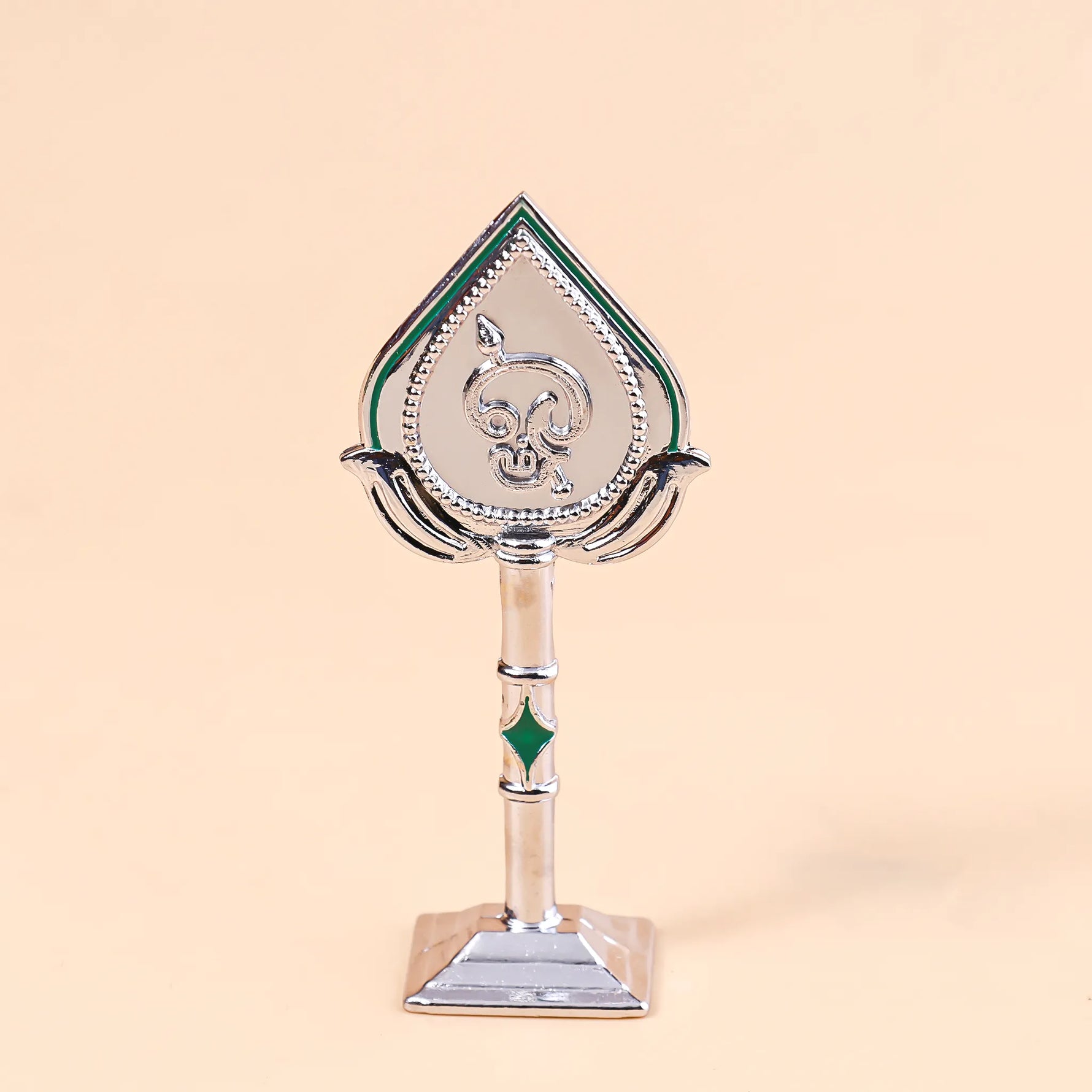 Decorative trophy with a green and silver design on a beige backgroundMurugan Face Mina – Divine Blessings & Protection | Abhimantrit & Certified