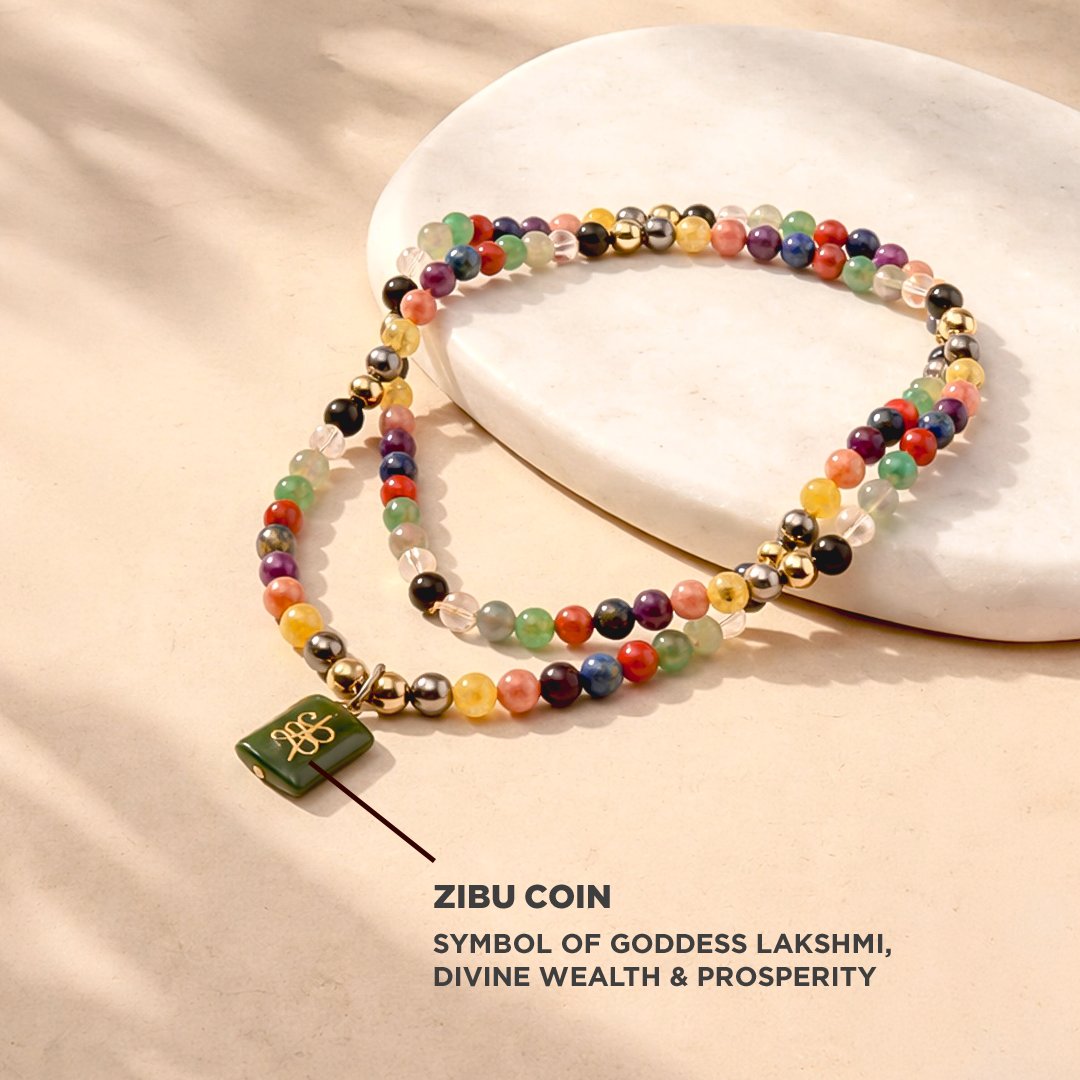 Colorful beaded bracelet with a green coin charm on a beige background, featuring text about ZIBU COIN and Goddess Lakshmi.
