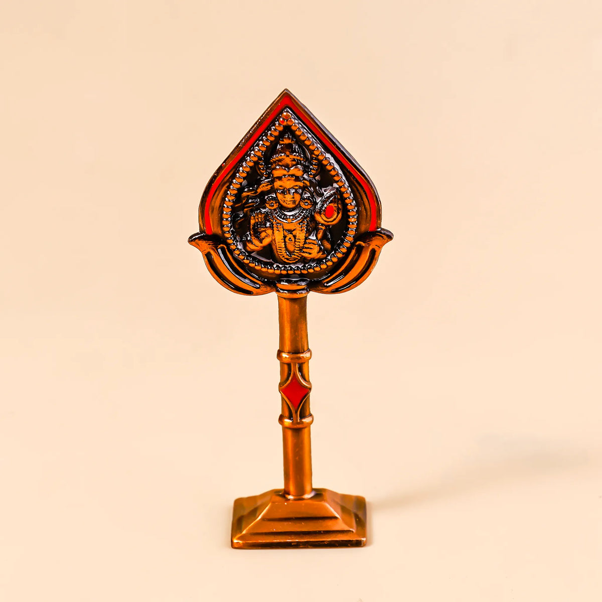 Decorative item with a central figure on a beige background
