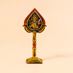 Decorative object with a central figure on a beige background