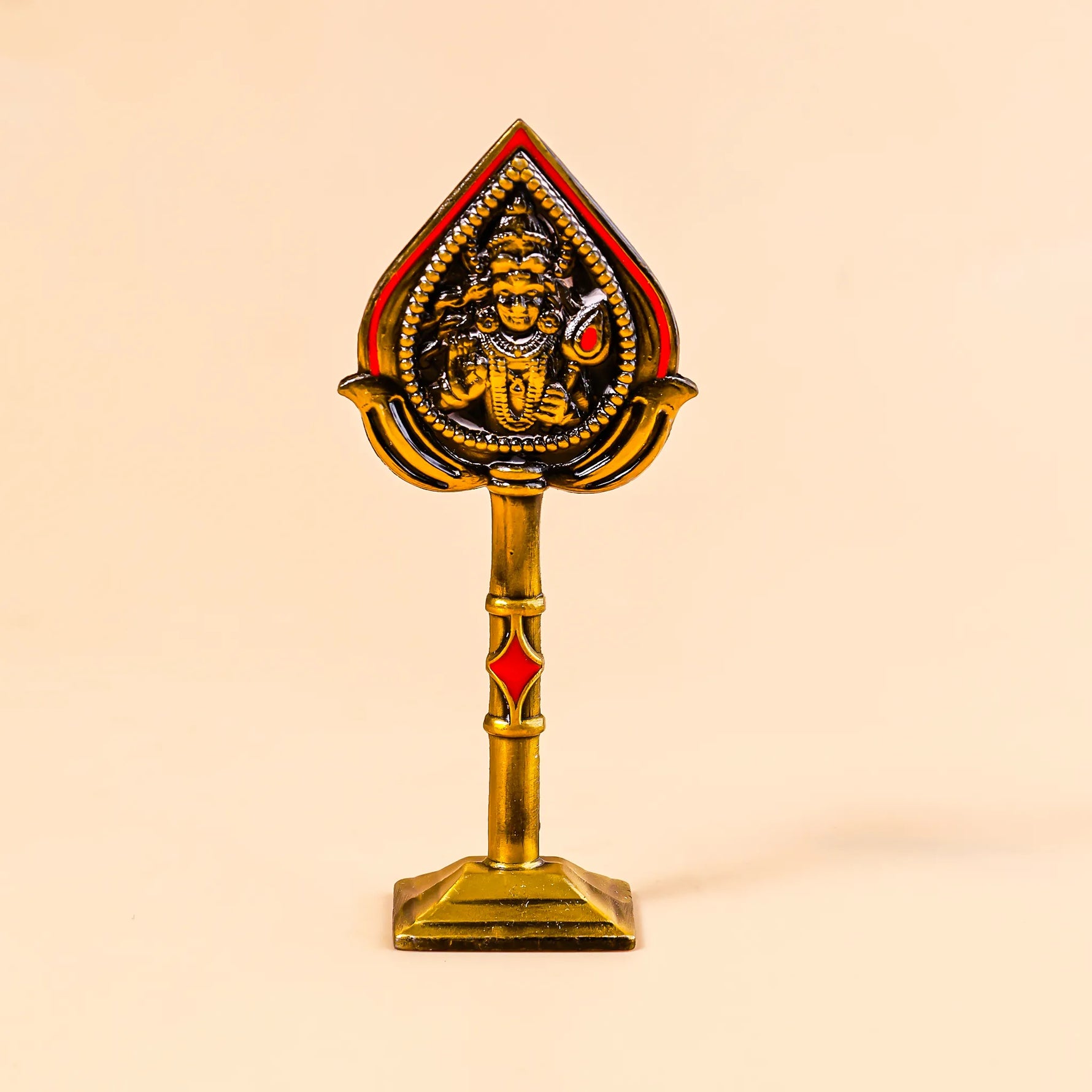 Decorative object with a central figure on a beige background