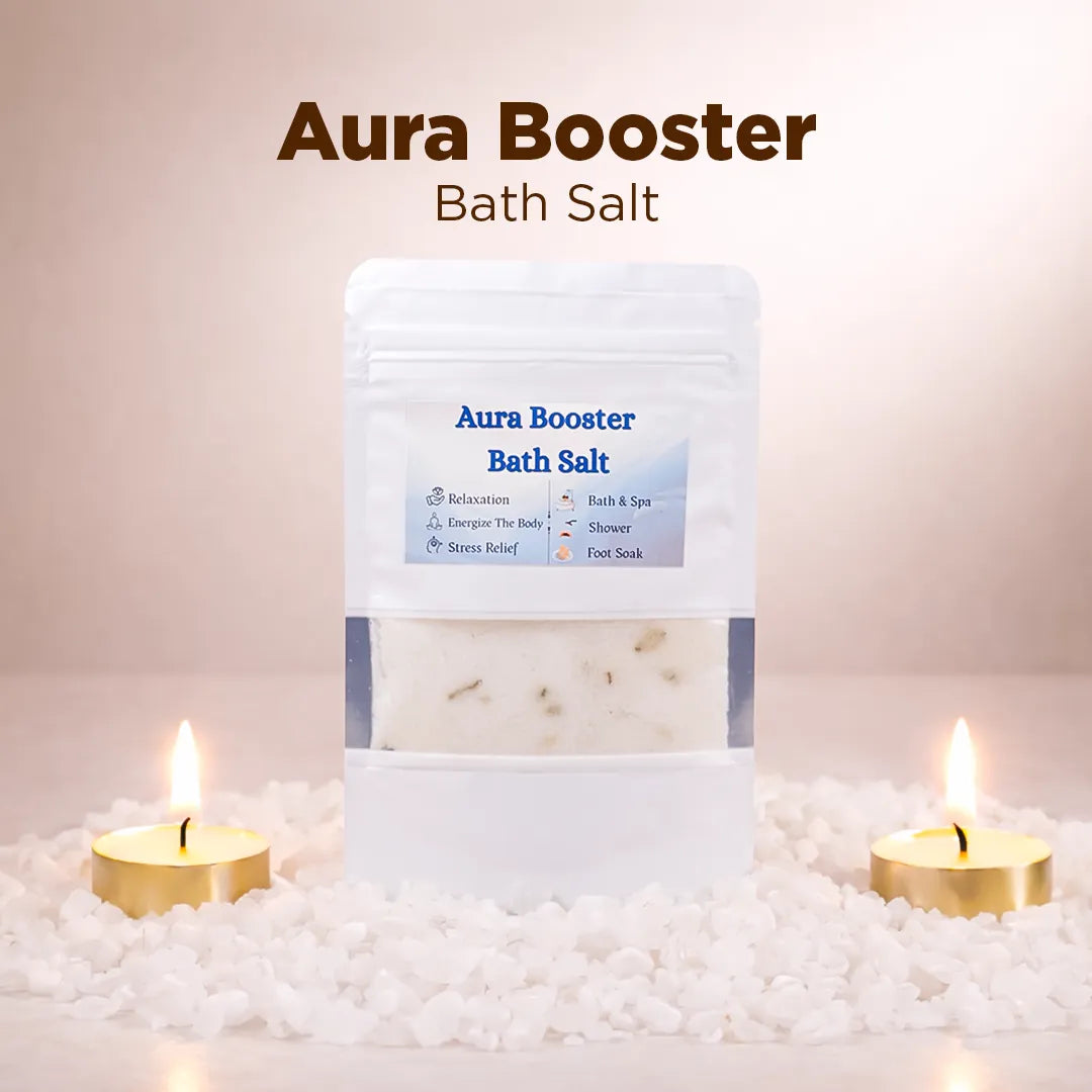 Aura Booster bath salt packaging with candles and bath salts on a soft background