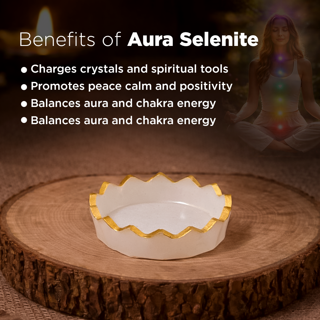 White dish with gold rim on a wooden surface, surrounded by text about Aura Selenite benefits.Aura Selenite Bowl for Energy Cleansing & Crystal Charging - Abhimantrit