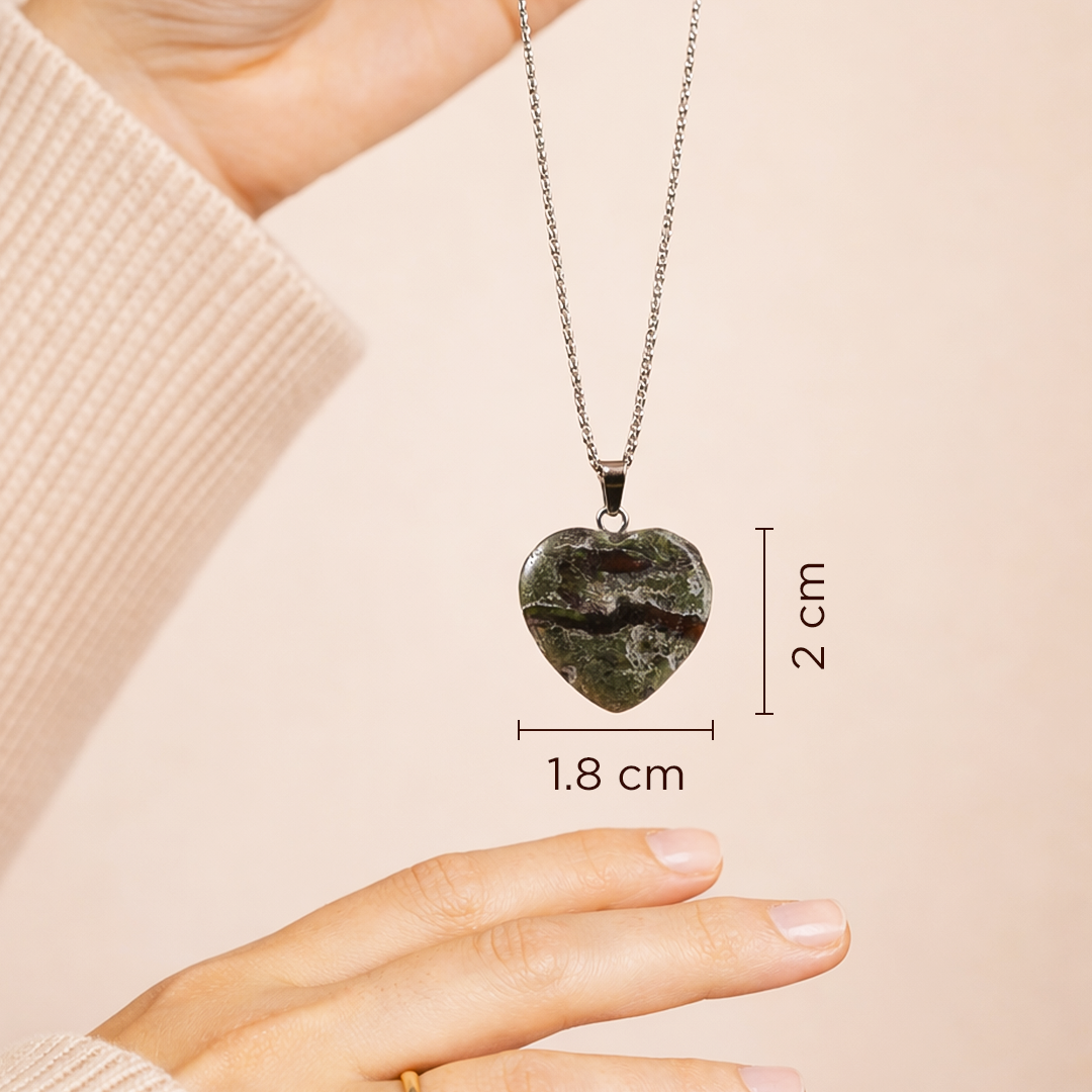 Heart-shaped pendant necklace with measurements on a beige background