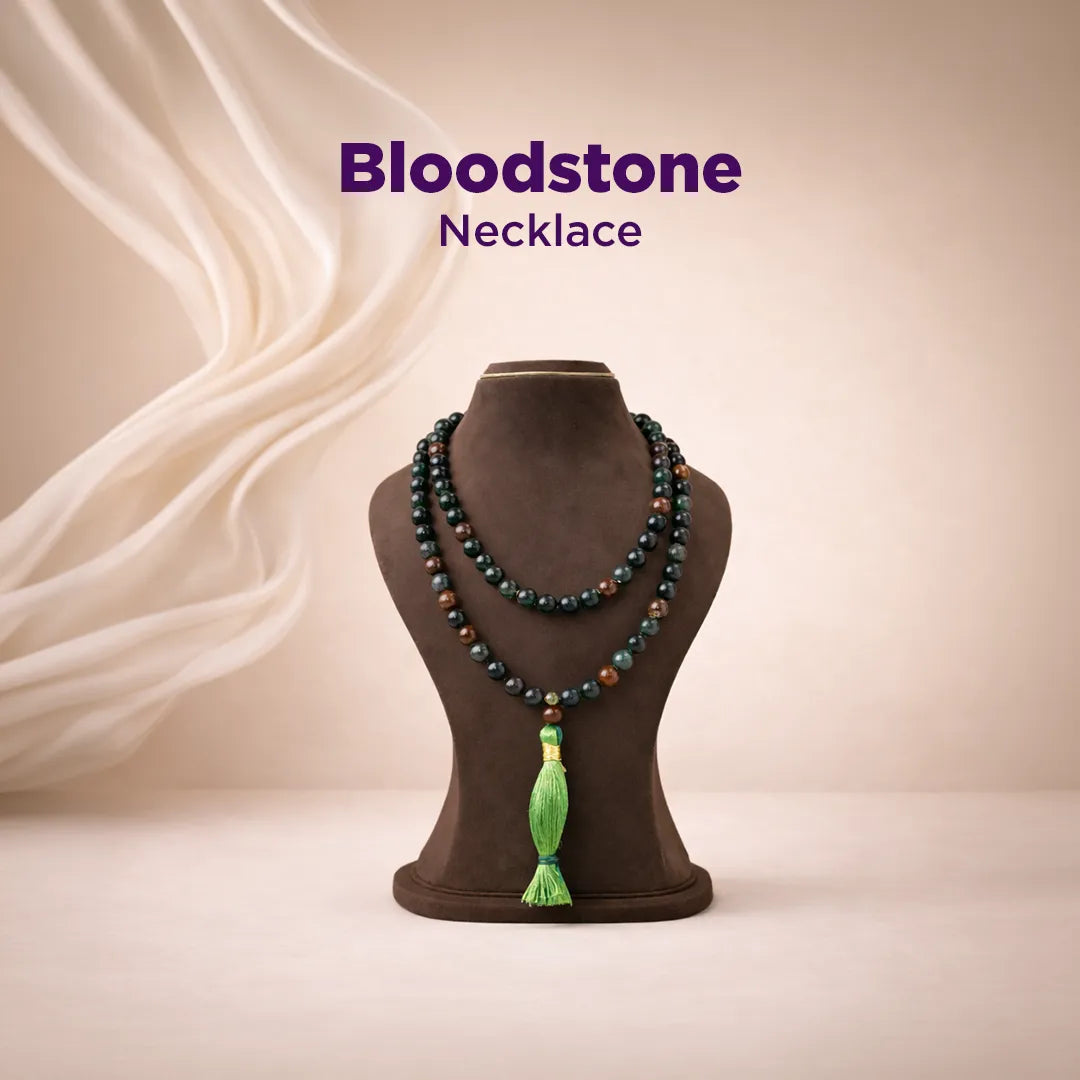 Bloodstone necklace on a mannequin with a beige background