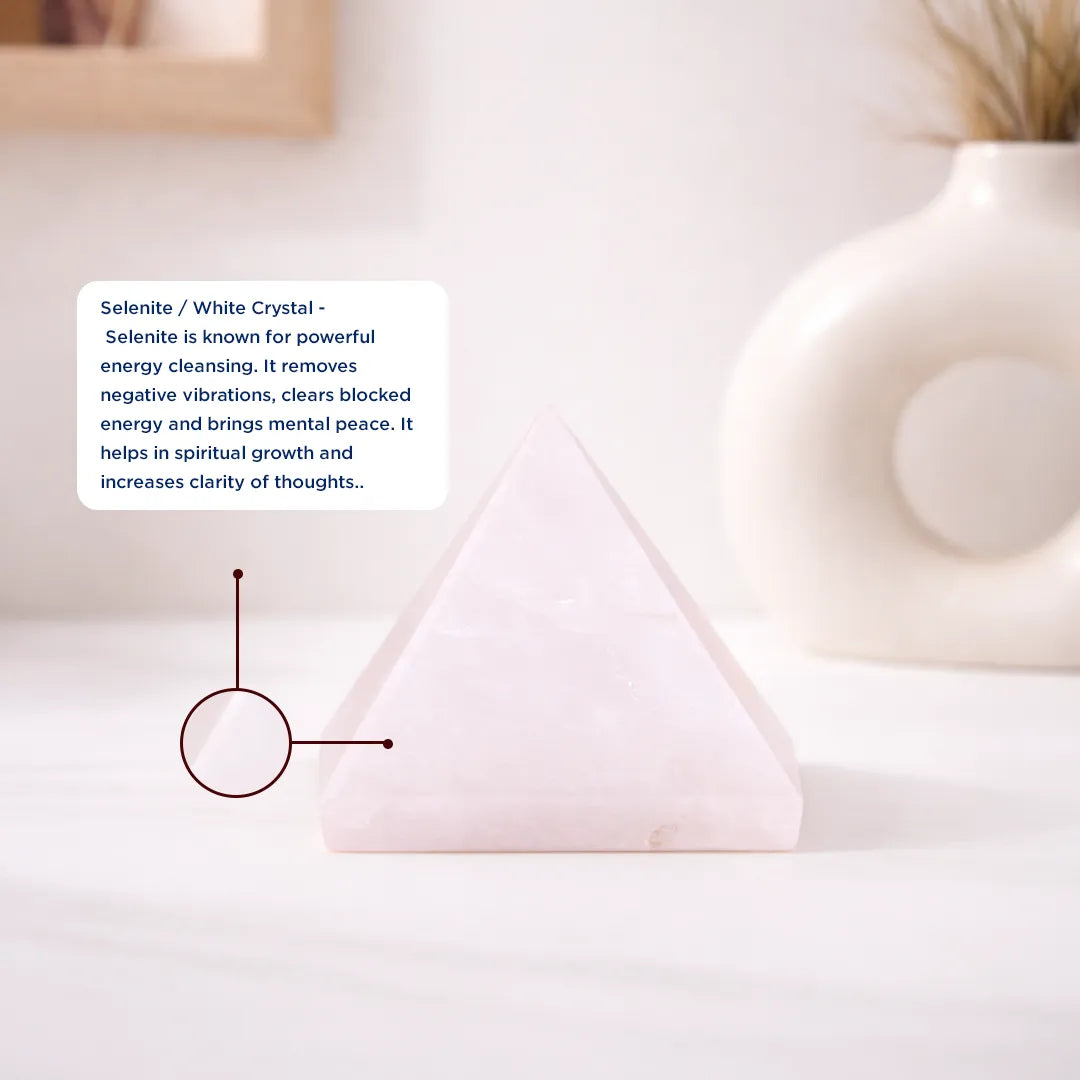 Selenite crystal pyramid on a white surface with text about its properties.Clear Quartz Pyramid – Energy Cleansing, Meditation & Focus Crystal Pyramid