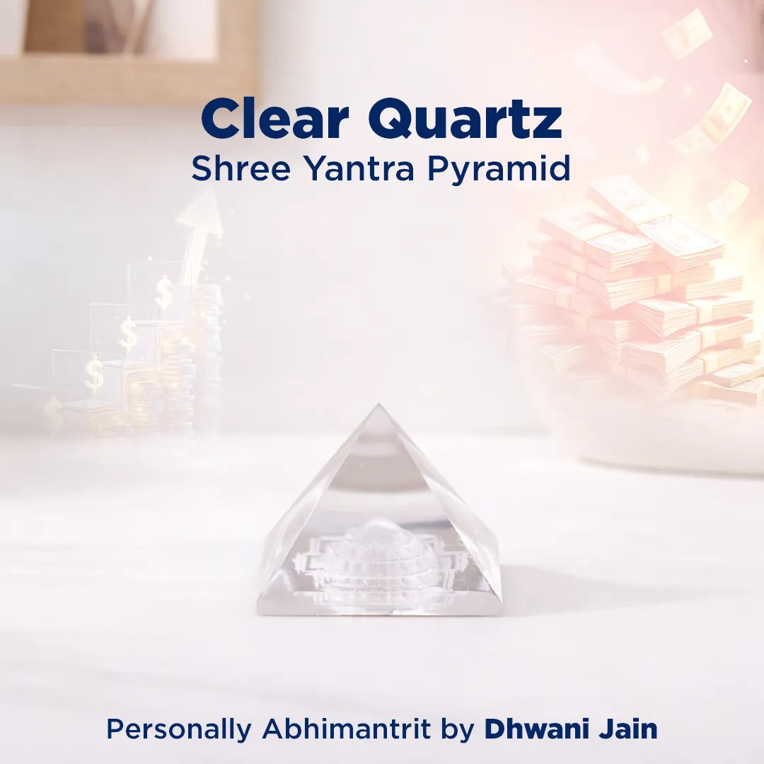 Clear Quartz Shree Yantra Pyramid on a white surface with soft lighting