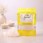 Bag of coffee bath salts with a label on a light background