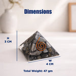 Pyramid-shaped stone with a spiral design, labeled with dimensions and weight on a neutral background.