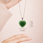 Green heart-shaped pendant on a chain with measurements displayed