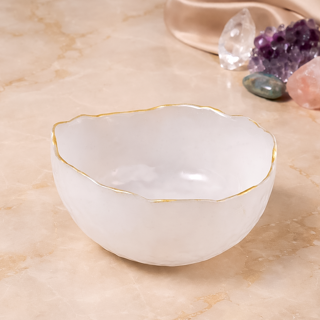 White ceramic bowl with gold rim on a marble surfaceDivine Selenite Bowl - Crystal Cleansing & Energy Bowl