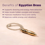 Gold bullet-shaped pendant on a chain with text about Egyptian Brass benefits on a pink background