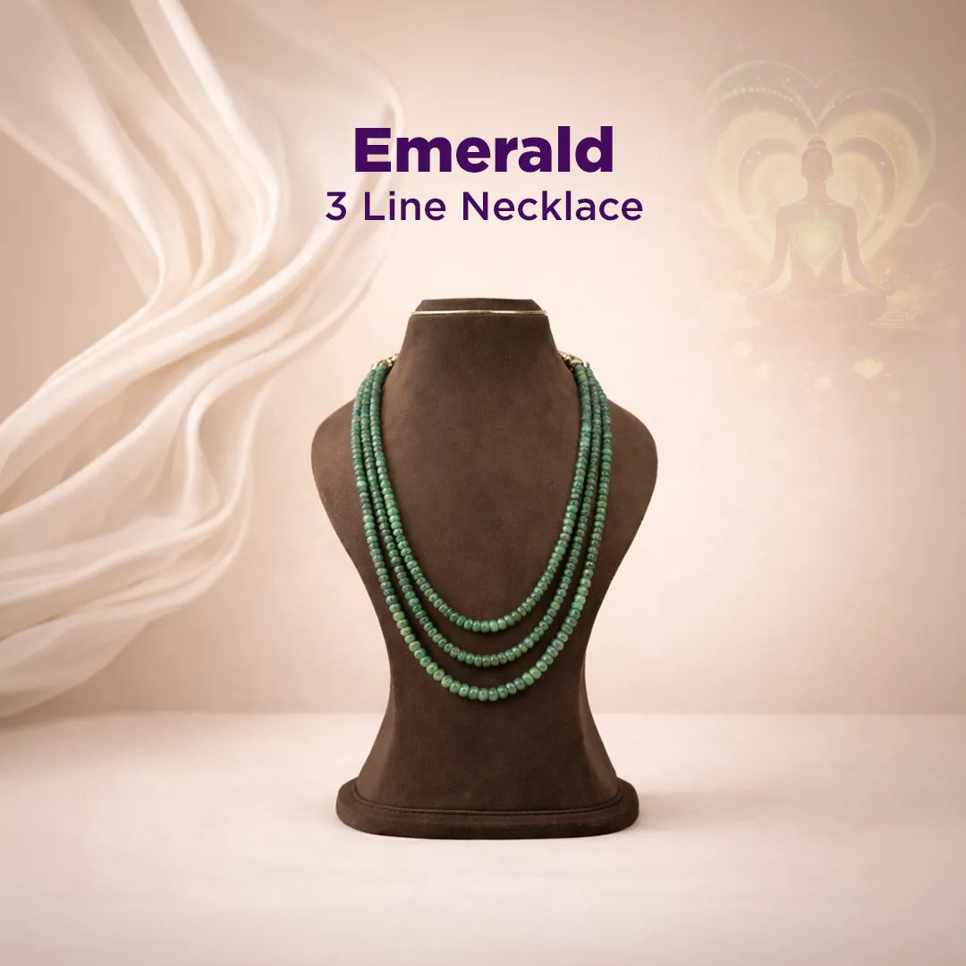 Emerald 3-line necklace on a mannequin bust with a soft, neutral background