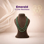 Emerald 3-line necklace on a mannequin bust with a soft, neutral background