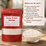 Energy Booster Bath Salt packaging with a bowl of bath salt on a wooden surface