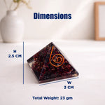 Pyramid-shaped crystal with measurements on a white surface