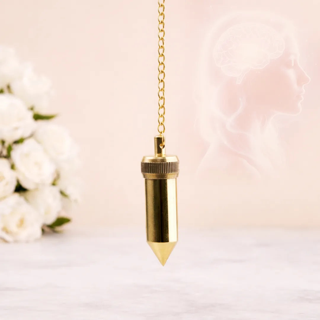 Gold pendulum on a chain against a soft floral background