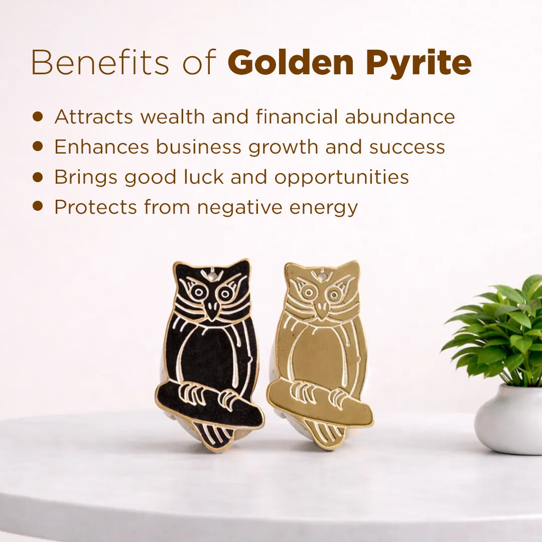 Two owl-shaped figurines, one black and one gold, on a white surface with text about the benefits of golden pyrite.