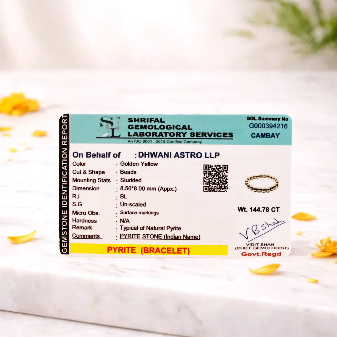 Shriraf Gemological Laboratory Services identification report for a pyrite bracelet on a marble surface with flowers.Fame & Fortune Attract: Golden Pyrite Bracelet - Abhimantrit & Certified