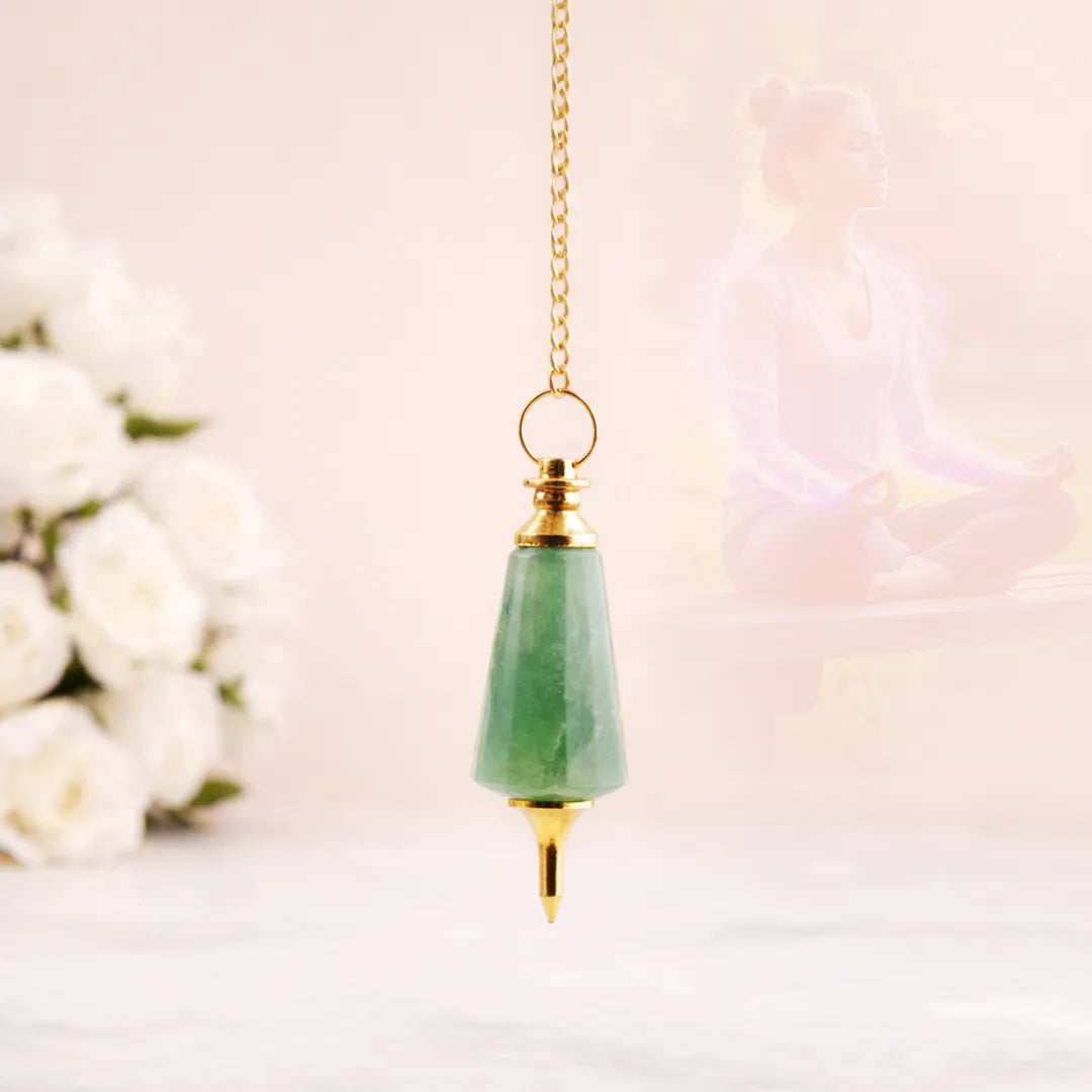 Green teardrop pendant with gold chain on a blurred floral backgroundGreen Aventurine Pendulum for Luck, Prosperity & Dowsing - Abhimantrit
