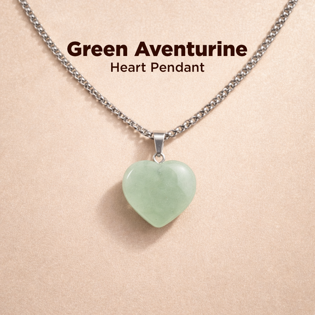 Green aventurine heart pendant necklace on a beige background
