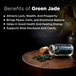 Glass jar with green stones on a wooden surface, with text about the benefits of green jade.