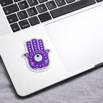 Purple Hamsa hand sticker on a laptop