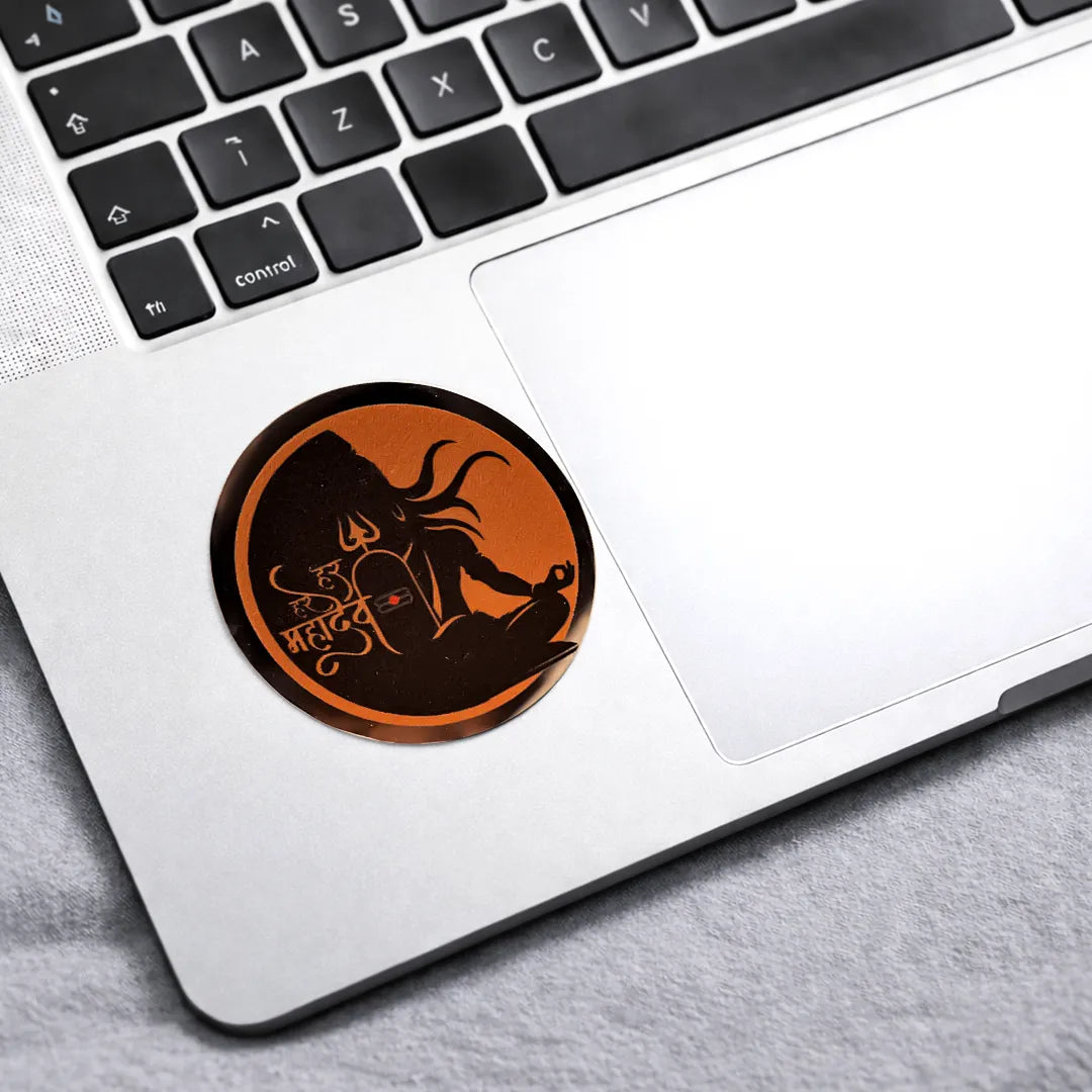 Circular sticker with a design on a laptop