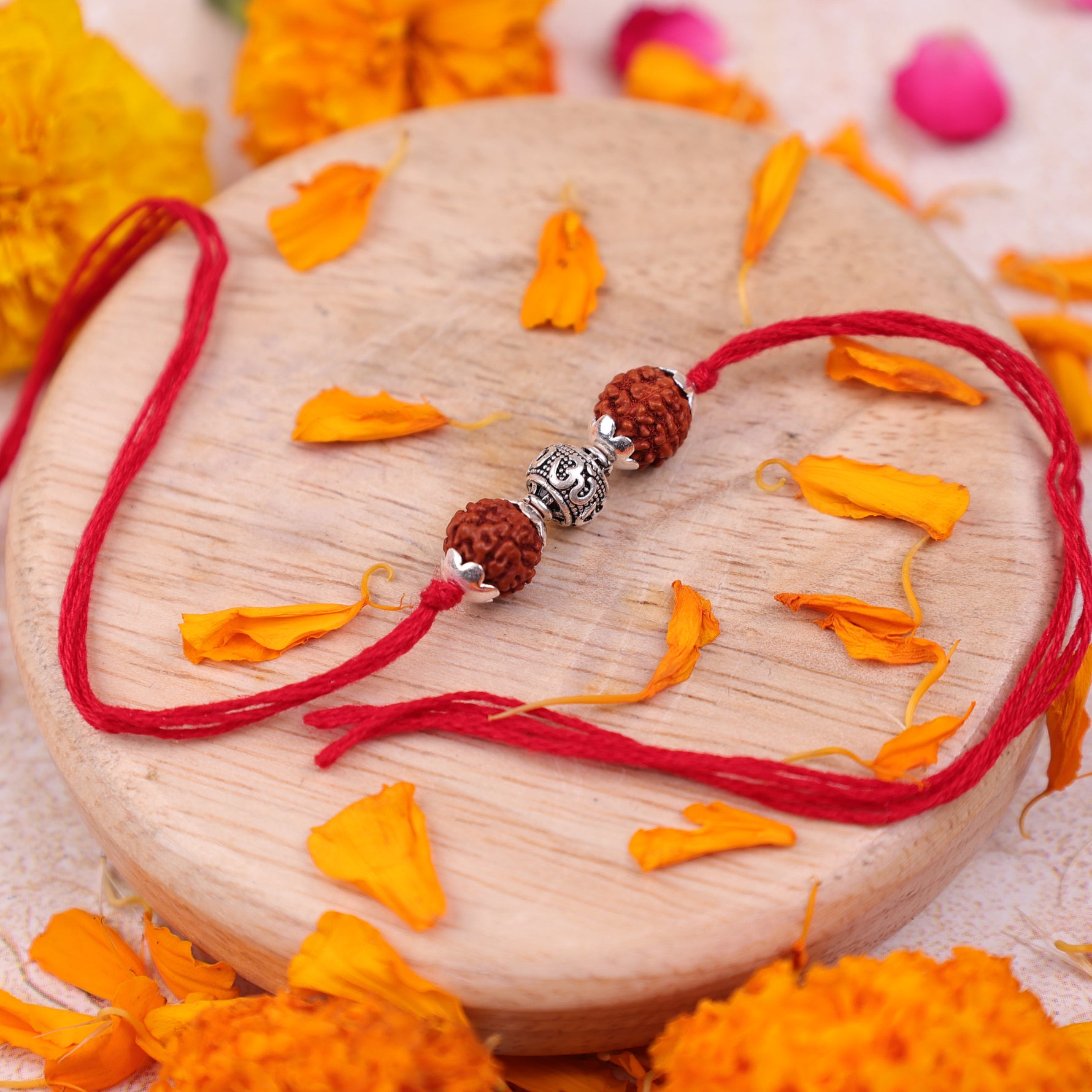 925 Sterling Silver 5 Mukhi Rudraksha Rakhi with Om bead on adjustable red thread for Raksha Bandhan gift.925 Sterling Silver 5 Mukhi Rudraksha Rakhi, Spiritually Energized Raksha Bandhan Bracelet for Brother