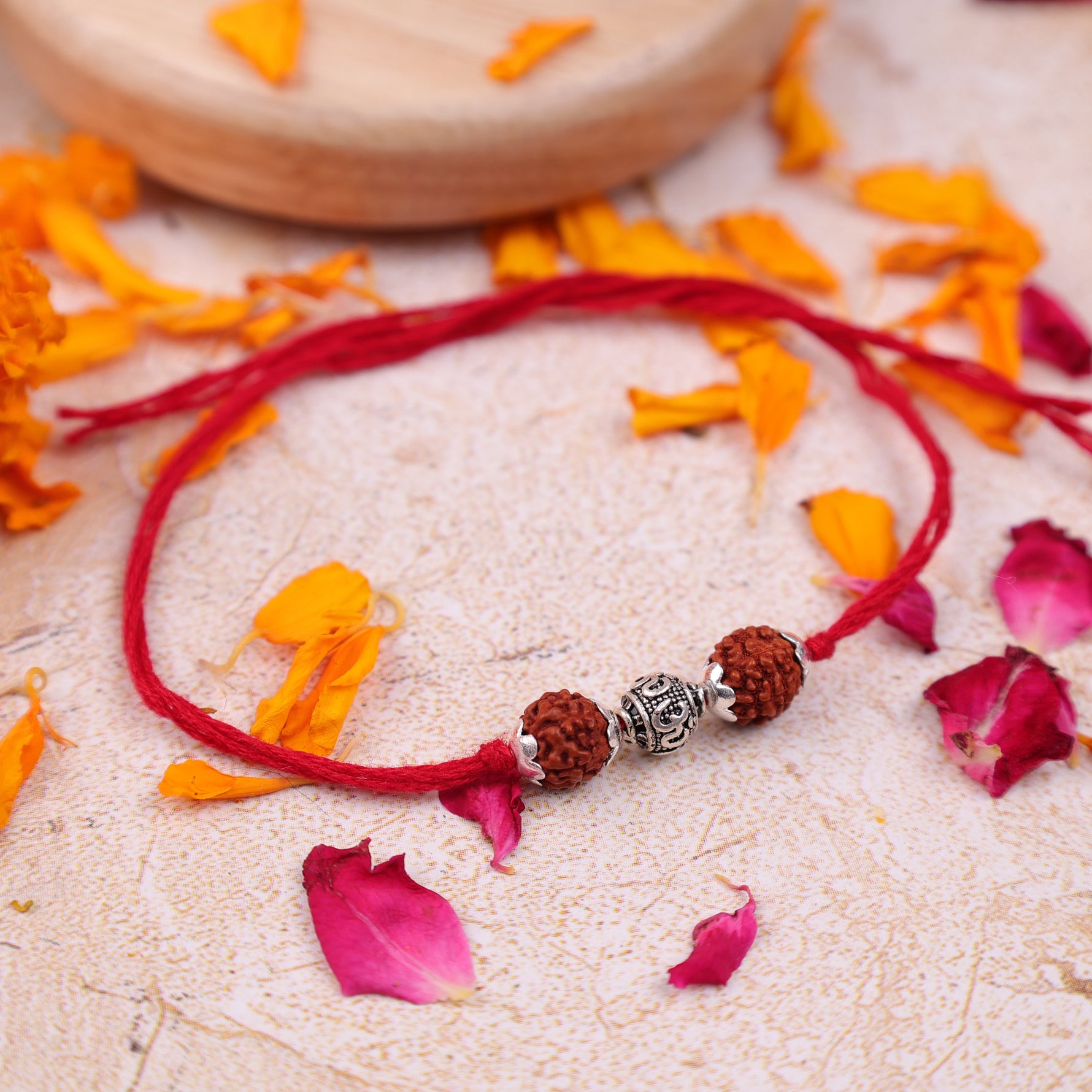 Adjustable 925 Sterling Silver 5 Mukhi Rudraksha Rakhi bracelet for brother with sacred Om design.925 Sterling Silver 5 Mukhi Rudraksha Rakhi, Spiritually Energized Raksha Bandhan Bracelet for Brother