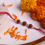Triple 5 Mukhi Rudraksha Rakhi handcrafted with 925 Sterling Silver Beads and traditional red thread