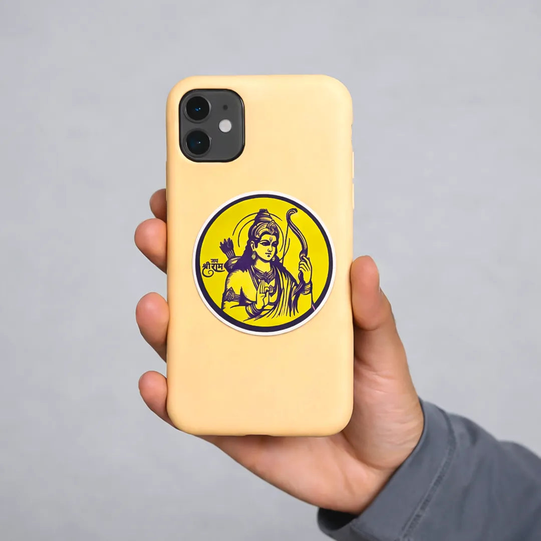 Hand holding a beige phone case with a yellow circular design on a gray background