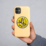 Hand holding a beige phone case with a yellow circular design on a gray background