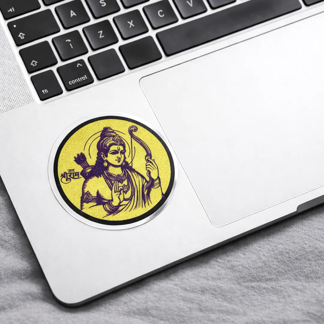 Laptop with a sticker of a deity on the palm rest area
